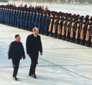 President Ford reviews Chinese troops with Chinese Premier Deng Xiaoping. Ford s Foreign Policy In foreign affairs, President Ford tried to follow Nixon s policy of détente.