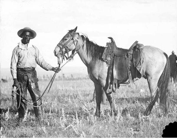 saddle, spurs, boots, chaps, and the hat.