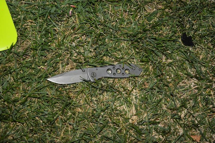 showing a knife on the ground.