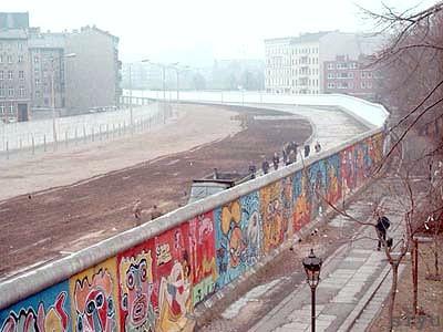 Berlin Wall (continued) -For almost 30 years, the Berlin Wall (aka Die Mauer) would stand as a symbol of the divide between East and West -Troops in guard towers prevented East Germans from