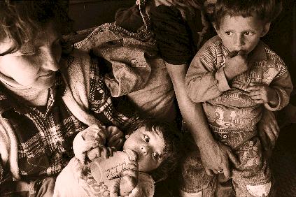 An early Kosovar refugee family in northern Albania in 1998. Annual totals worldwide of persons of concern to UNHCR [ AS AT 1ST JANUARY ] 1990... 14, 916, 498 1991... 17, 209, 722 1992.