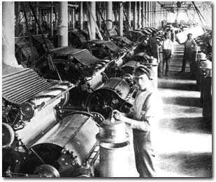 A time when the extensive use of machines to produce products resulted in a shift from home-based hand manufacturing to large-scale factory production.