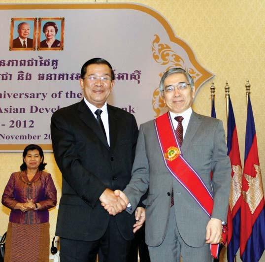 Right: Then-ADB President Kuroda meets Prime Minister Hun Sen