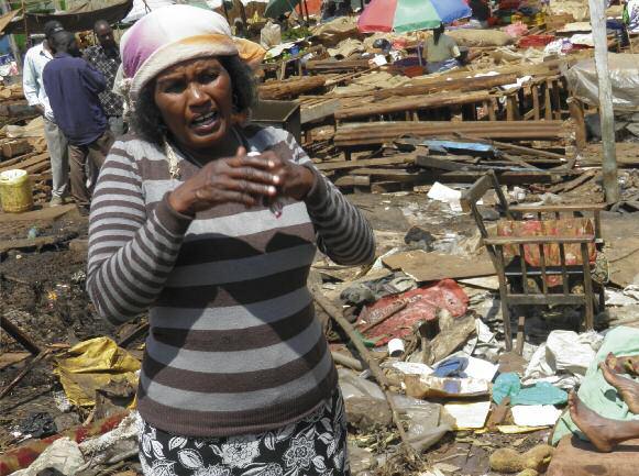 Amnesty International Elizabeth, 49, a resident in Kabete settlement, Nairobi, Kenya, surveys the destruction after Nairobi City Council bulldozers flattened buildings, demolishing