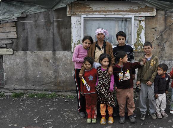 Amnesty International N atalia, her five children, and friends outside their home in Muntii Tatra Street informal settlement in Constanţa, Romania, April 2011.