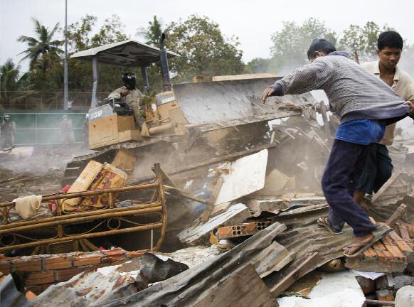 Nicolas Axelrod Without warning bulldozers and police entered the Dey Krahorm community in Phnom Penh,