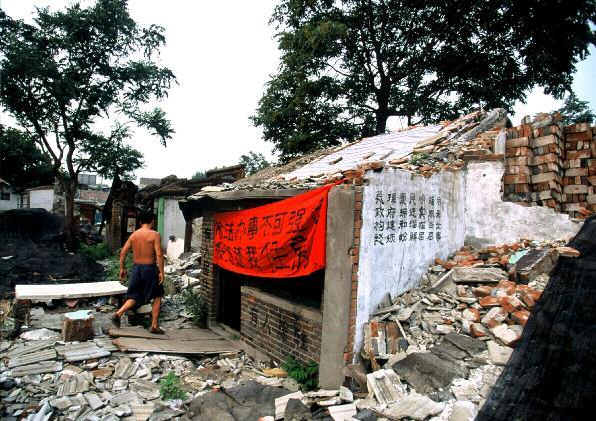 Dubin A semi-demolished home in the Qianmen district of Beijing, China, 2006.