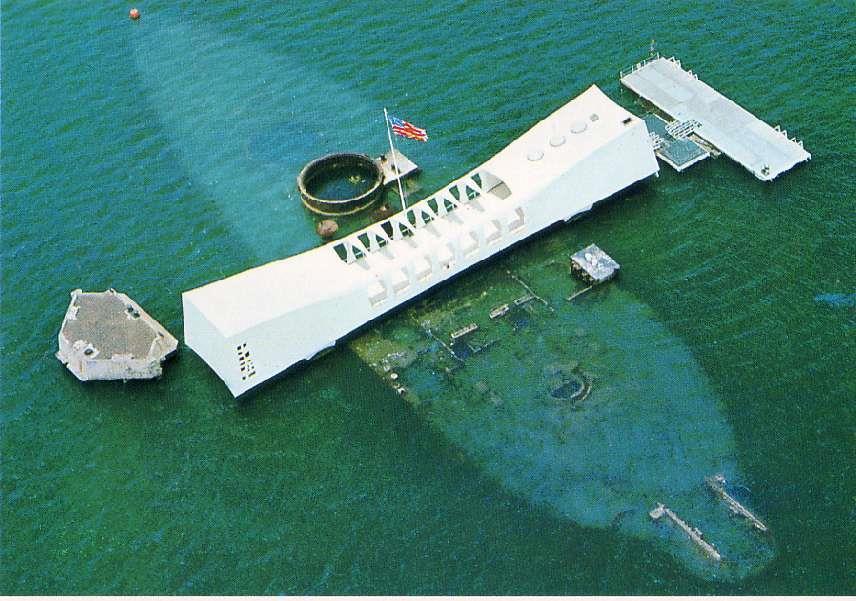 Arizona (right) remains submerged as memorial to the fallen.