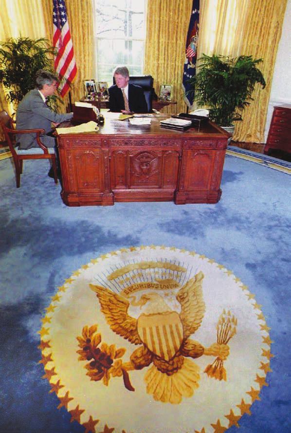 58 THE PRESIDENCY President Bill Clinton sits at his desk, known as the HMS Resolute, in the Oval Offi ce.