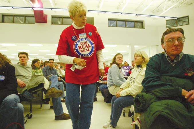 76 THE PRESIDENCY A supporter of John Kerry offered last- minute advice at a caucus site in Des Moines, Iowa, in January 2004.