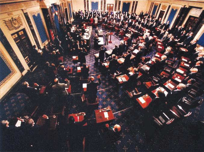 PRESIDENTIAL TRANSITIONS 87 In this photo from the U.S. Senate, Chief Justice William H. Rehnquist swore in the U.S. senators as jurors in January 1999 in the impeachment trial of President Bill Clinton.