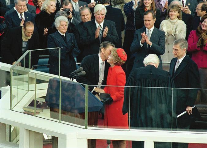 98 THE PRESIDENCY President Ronald Reagan kissed his wife, Nancy, just after being sworn in as the fortieth U.S. president on January 20, 1981.