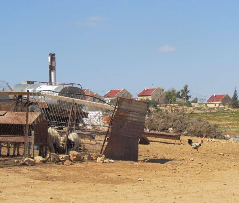 The Bedouin community of Um al Kher (Hebron), looking towards the adjacent Israeli settlement of Karmel.