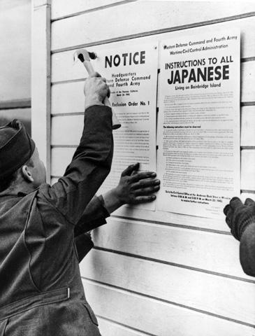 Los Angeles County, California. Exclusion Order being posted in Little Tokyo ordering the evacuation of Japanese and Japanese-Americans from West coast areas. Lee, Russell, 1903- photographer.