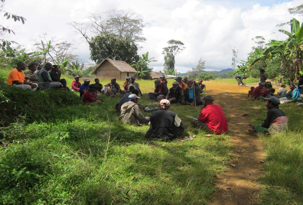 Photo of a public consultation being conducted under some trees in Kerapali ward near the Tunda Junction.