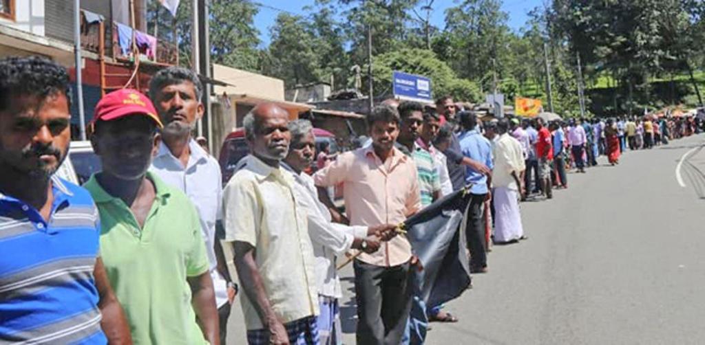 Workers lining up for a rally at Pussellawa CWC leader Arumugam Thondaman became a cabinet minister in the newly appointed Rajapakse administration, and immediately claimed that the new prime