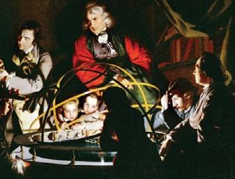 This painting shows people examining a miniature planetarium, which presented new ideas about the structure of the solar system.
