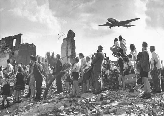 Going Over Their Heads To break the blockade, American & British officials started the Berlin Airlift to fly food & supplies into West Berlin For 327 days, planes took off & landed every few minutes