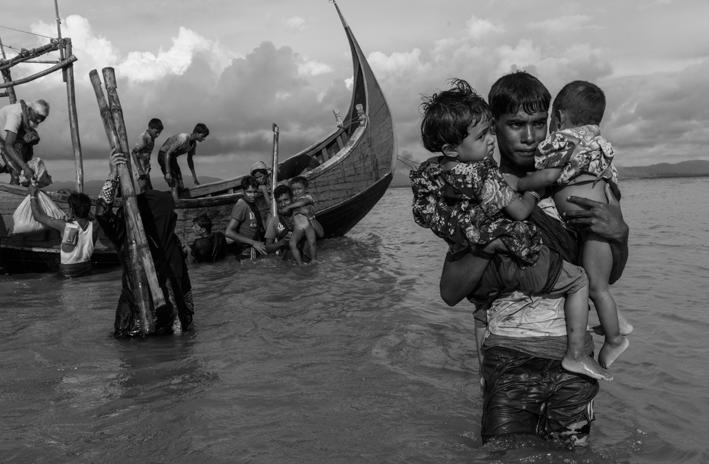 Impact of the crisis REFUGEES FLEEING RAKHINE STATE BY BOAT ARRIVE ON THE BEACH IN DAKHINPARA, BANGLADESH Credit: UNHCR/ A. Dean 07 generally excluded from Myanmar s body politic.