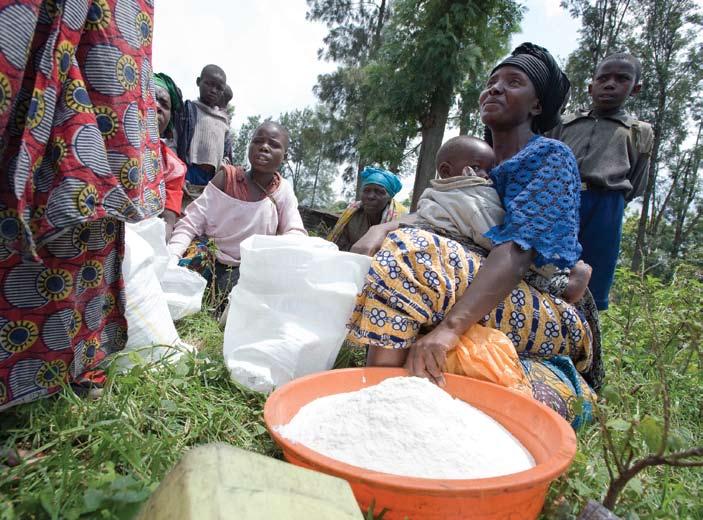 A displaced woman with food rations in Kabati camp, DRC. Photo courtesy of UNHCR/P. Taggart/November 2008.