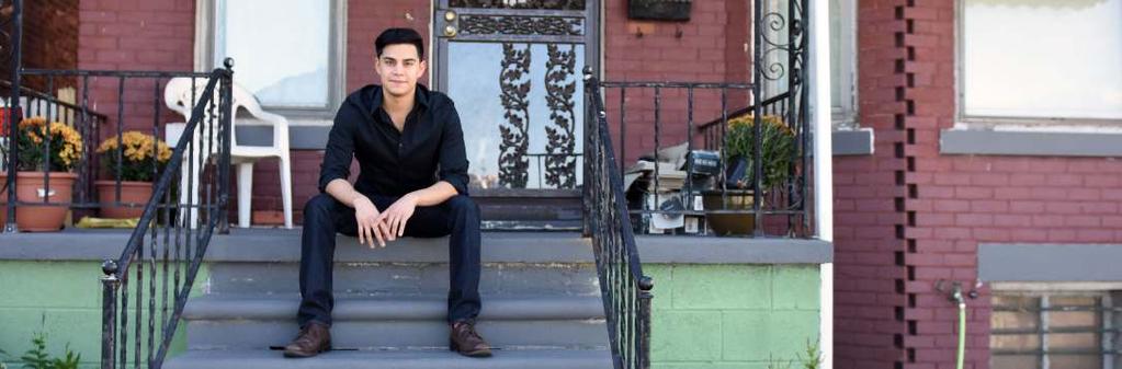 Sergio, a DREAMer who arrived in the U.S. at age 3, in front of his Detroit home that he renovated.