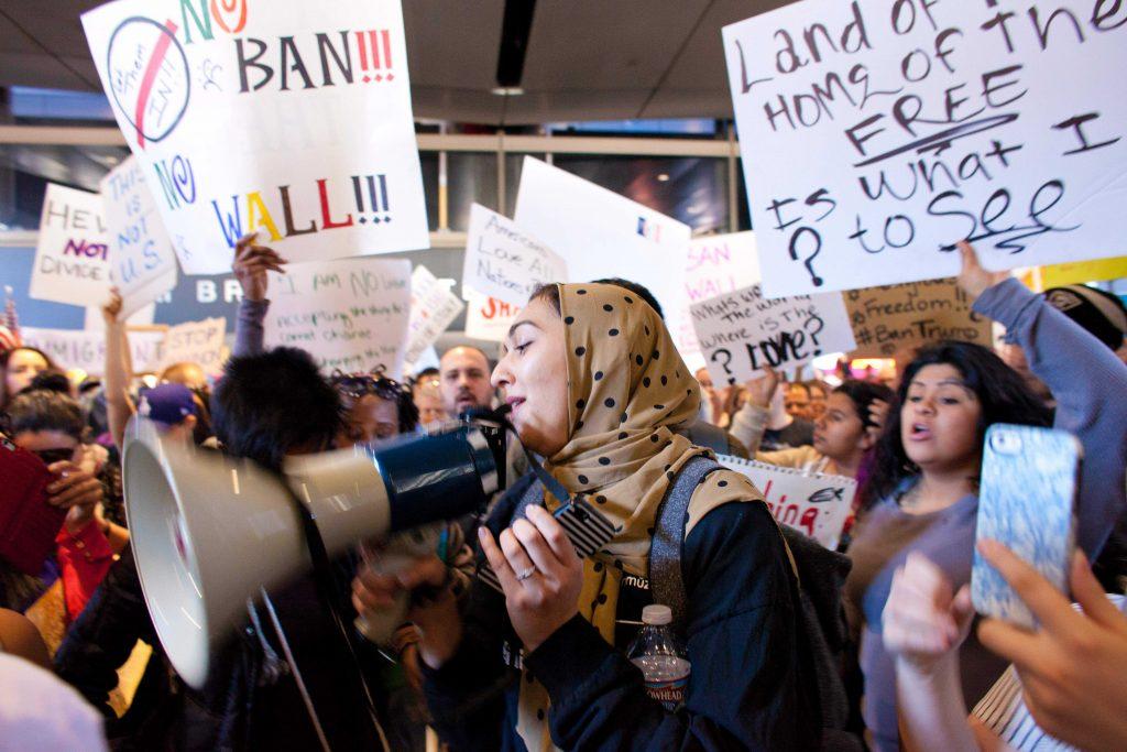 Protesters gather at the Los Angeles International Airport s Tom Bradley Terminal to demonstrate against President Donald Trump s executive order effectively banning citizens from seven