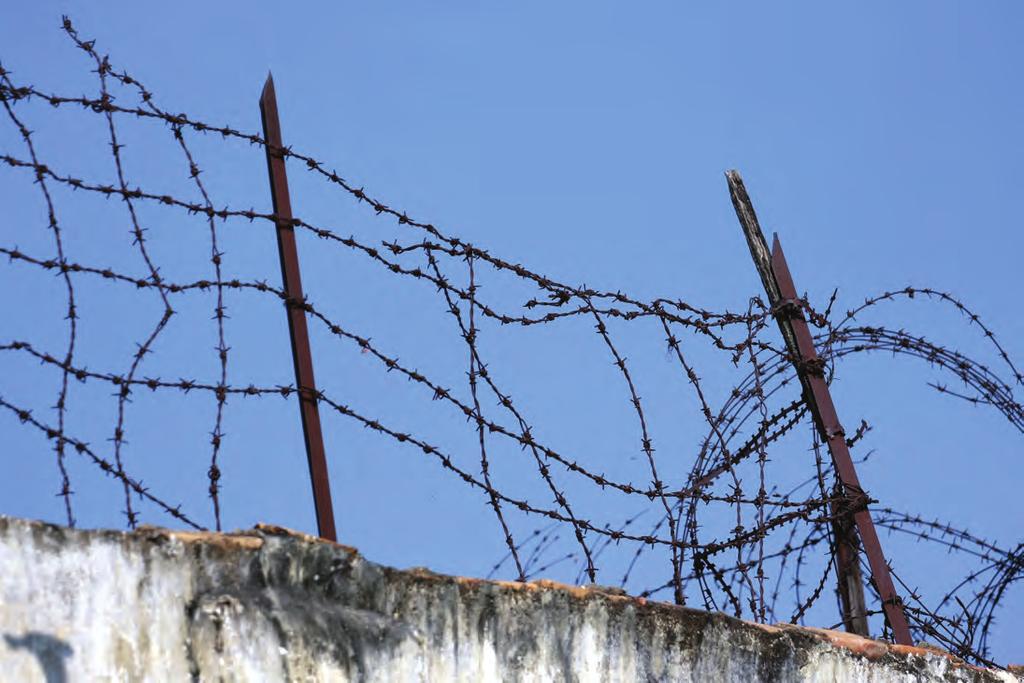 The Impact in Phnom Penh Barbed wire in Phnom Penh s Correctional Center 2 prison.