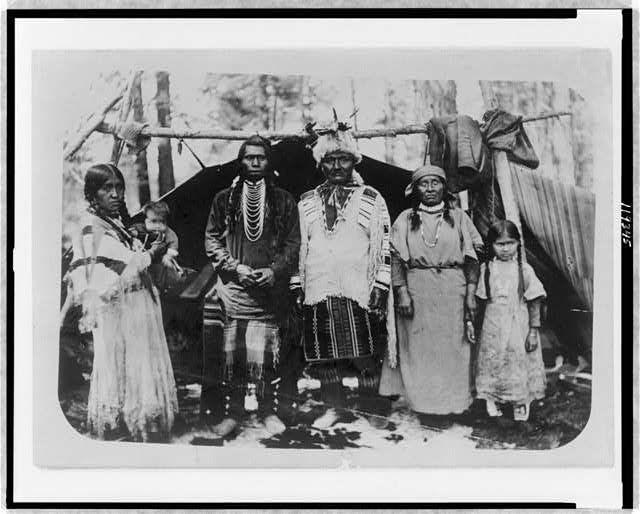 A Native American family poses unhappily at the Warm Springs Reservation in Oregon,