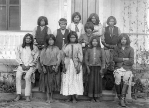 Photo 1: Chiricahua Apaches as they arrived at Carlisle Indian School Photo 2: Chiricahua Apaches 4 months after arriving at Carlisle Indian School Ticket Out the Door Answer the