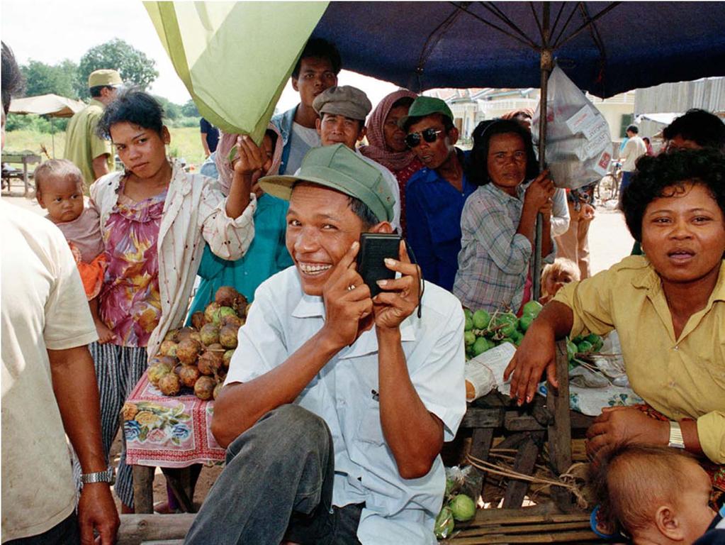 A Cambodian listening to a radio donated by a Japanese non-governmental organization and distributed by UNTAC's information and education division.