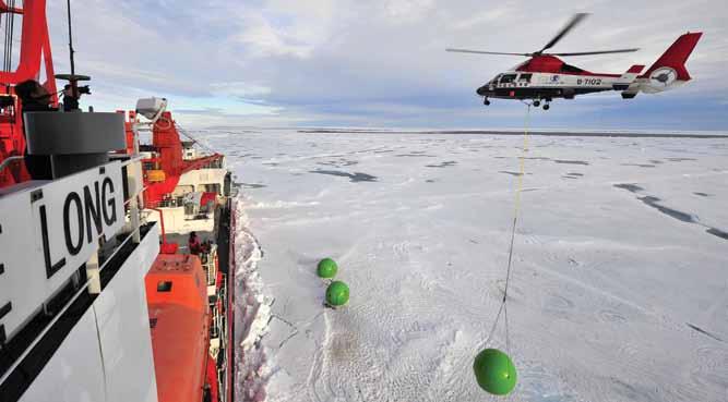 A Dolphin helicopter swings bear-proof apple houses onto China s Xue Long icebreaker at the North Pole on 19 August 2010.