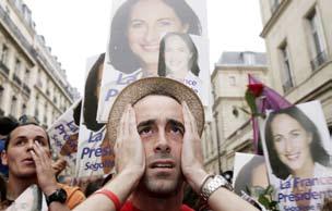 (Photo by Eric Bouvet/Getty Images) INSET: Supporters of Socialist presidential candidate Segolene Royal react after the announcement of the first unofficial results of the French