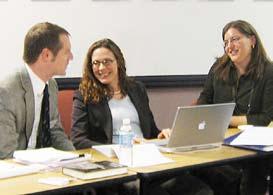 INSET BOTTOM Jason Parker (left), postdoctoral fellow, chats with Mary Sarotte (center), former