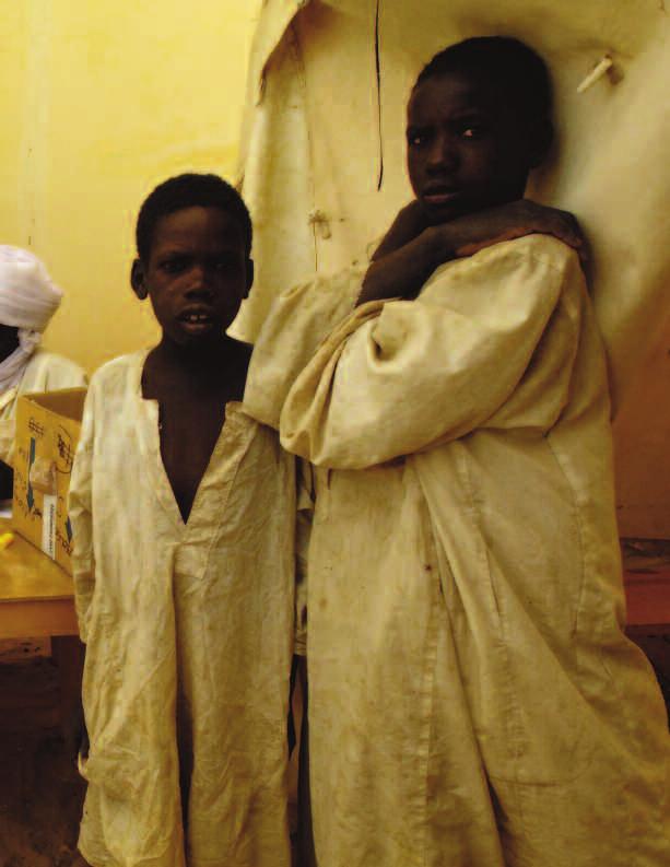 Sudanese refugees from Darfur seek help at a medical center in