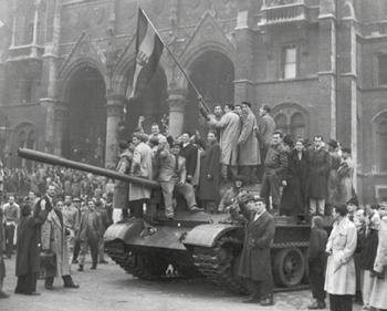 1.3 The Cold War intensifies Source D A photograph of Hungarian rebels waving their national flag in Budapest, Hungary. They are standing on top of a captured Soviet tank.